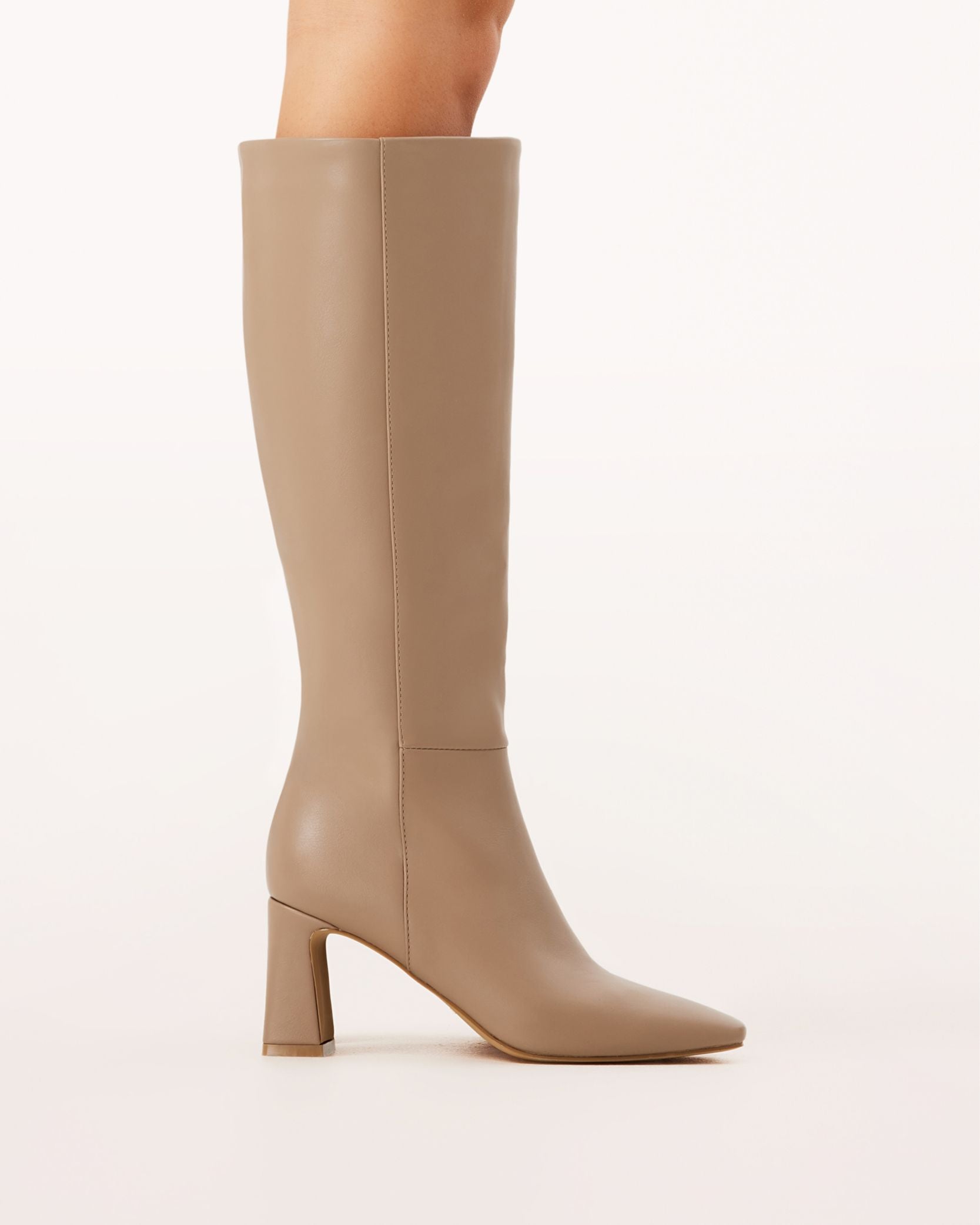 A pair of knee-high boots in a truffle brown tone with a block heel and square toe.