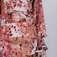 Floral dress with long sleeves and a white background