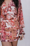 Floral dress with long sleeves and a white background