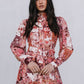 Woman wearing a floral dress with a plain background